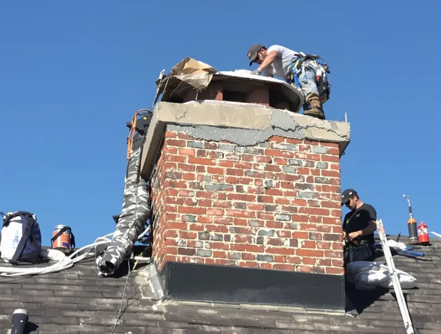 Largo Chimney Sweep installing a custom chimney crown in Largo, FL